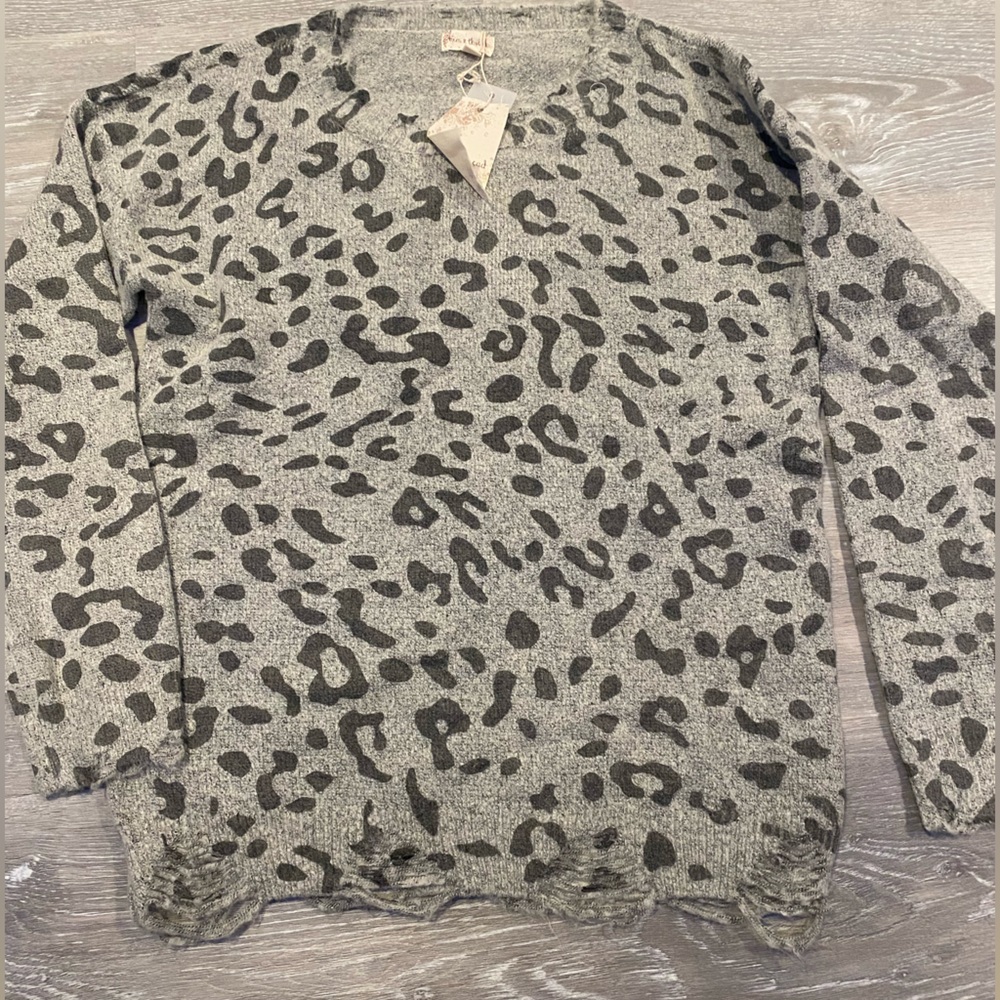 Distressed leopard sweater